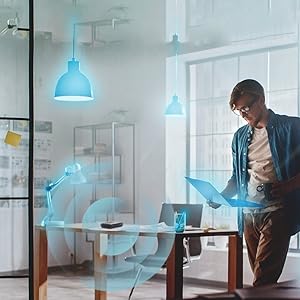 Man surrounded by smart home devices.