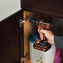 black+decker screwing in metal hinge of cupboard door