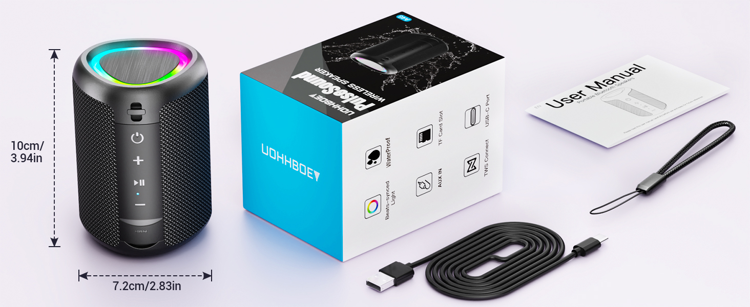 con anillo de luz LED en la parte superior. El paquete muestra la caja del producto, el cable USB y el manual de usuario incluidos.