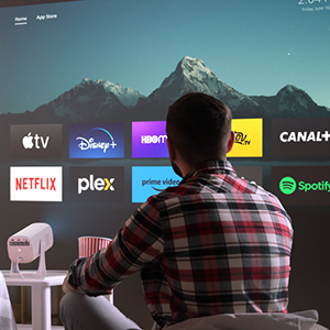 Pantalla que muestra varios logotipos de servicios de streaming, incluidos Netflix, Disney+, Apple TV y otros, con un telón de fondo montañoso
